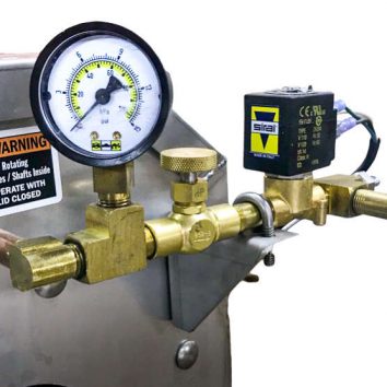 Metering gauge on a Power Scrub Egg Washer automatically shuts off water
